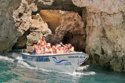 Feel the sea breeze on a lagos boat tour to ponta da piedade, weaving through grottos and past dona ana & camilo beaches. includes comfortable seats and local guide.