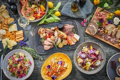 Savor a lakeside bbq lunch at walter peak after a scenic cruise from queenstown, watch a kiwi farm show, and relax with local flavors—includes return boat ride.