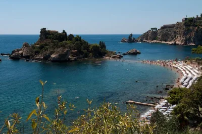 Feel the charm of taormina’s ancient streets, taste almond wine in castelmola, and catch views of mount etna. includes hotel or port pickup and local guide.