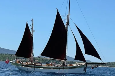 Feel the breeze off sardinia’s coral riviera on a classic tall ship, with swimming in porto conte bay, a fresh local lunch, and wine included. small group tour.