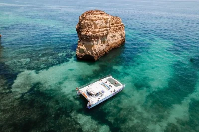 Sail from albufeira along the algarve coast, explore benagil caves, swim in hidden bays, and enjoy a fresh lunch onboard. includes drinks and experienced crew.