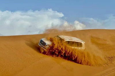 Feel the rush of dune bashing near dubai, ride camels at sunset, try sandboarding and unwind at a bedouin camp with live shows and a bbq dinner. pickup included.