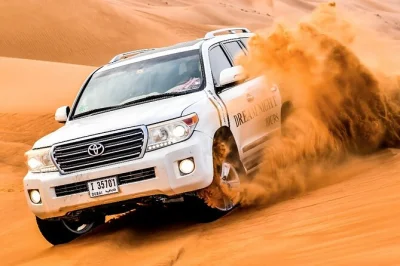 Feel the thrill of dubai’s red dunes with dune bashing, sandboarding, camel rides, and a live-cooked bbq dinner. includes hotel pickup and evening shows.