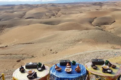 Experience a camel ride and dinner in agafay desert at sunset. includes pick-up, local meal, and tea. book this marrakech desert evening tour now.