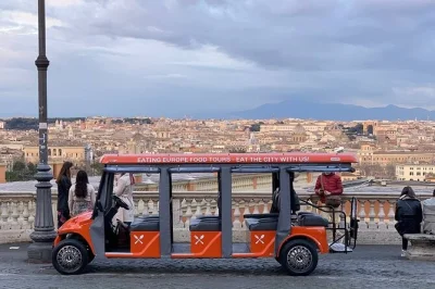 Raise a glass over rome’s rooftops, taste jewish artichokes, and ride a golf cart to testaccio market. includes food, drinks, and local guide pickup.