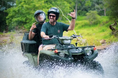 Ride a 2-person atv through jungle trails, rivers, and to hidden waterfalls near jaco beach. includes bilingual guides, fruit, and panoramic ocean views.