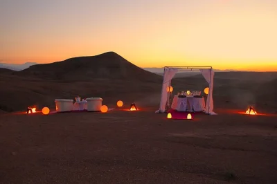 Dine under the stars in agafay desert. enjoy moroccan tagine, berber music, and sunset views. private transfer from marrakech included. book your spot now!