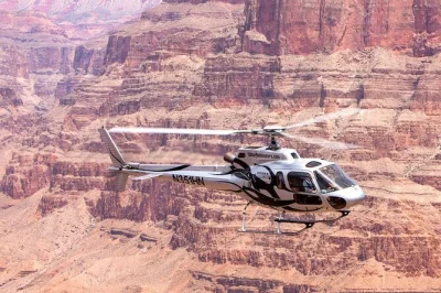 Feel the rush of a 90-minute grand canyon helicopter tour from las vegas, flying over lake mead, hoover dam, and the west rim. includes hotel pickup and expert pilot.