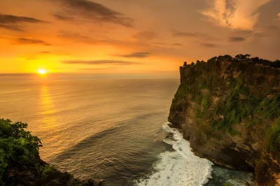 Feel the ocean breeze at uluwatu temple, watch the kecak fire dance at sunset, and end with grilled seafood on jimbaran beach. includes hotel pickup and private guide.