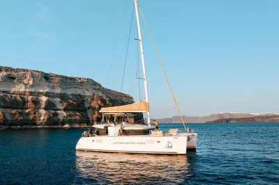 Set sail from santorini’s vlychada port for a sunset catamaran cruise, swim at red beach, soak in hot springs, and enjoy greek bbq dinner with drinks included.