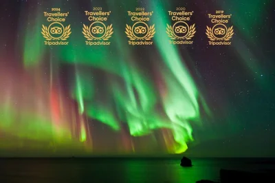 Explore a aurora boreal saindo de reykjavik com guias locais, fotos profissionais, chocolate quente caseiro, cinnamon rolls e transporte incluso. pequeno grupo sob o céu da islândia.