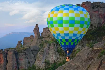 Experience a hot air balloon bungee jump over belogradchik rocks. book your adrenaline adventure in bulgaria with pro guides and all equipment included.