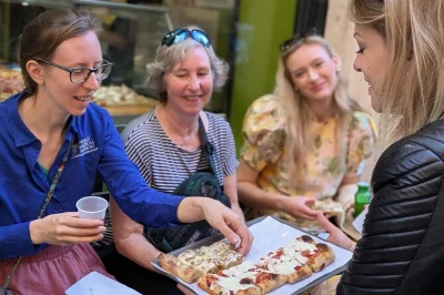 Follow a local through trastevere and campo de' fiori, tasting roman street food like pizza and suppli. small group, includes gelato and a top-rated guide.