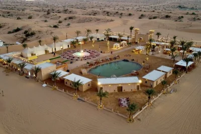 Feel the desert come alive near dubai with dune bashing, sandboarding, camel rides, lakeside bbq dinner, and live shows. includes hotel pickup & guide.