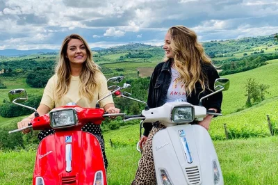 Feel the tuscan breeze on a vespa ride from florence, wander a medieval village, and enjoy chianti wines with lunch. small group tour includes pickup & guide.