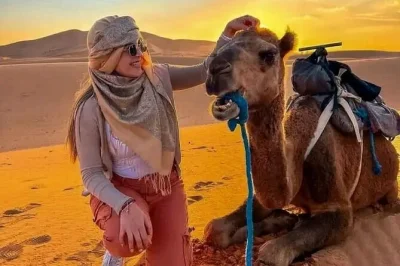 Let the desert air, berber music, and a sunrise over erg chebbi dunes shape your night in merzouga. includes camel trek, dinner, breakfast, and camp stay.
