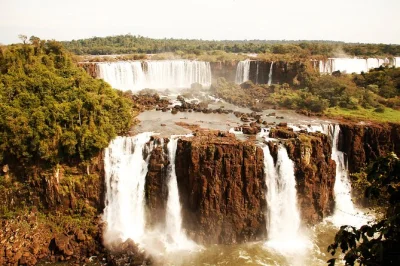 Feel the spray at iguazu falls from brazil & argentina, walk devil’s throat, and catch rainbows with a local guide. includes hotel pickup and border crossing help.