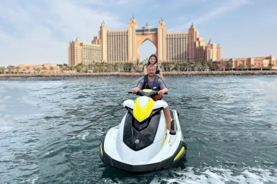 Feel the rush on a dubai jet ski tour past burj al arab and atlantis, with skyline views, photo stops, and guide-led fun. includes safety gear and changing room.