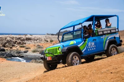 Feel aruba’s wild side on a jeep tour to conchi natural pool, indian caves, and baby beach, with hotel pickup, snorkeling gear, snacks, and a local guide included.