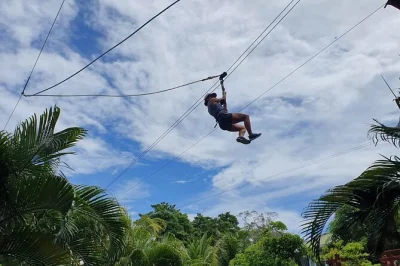All-in-one roatan tour: zip line adventure, animal sanctuary visit, city walk, plus rum & chocolate factory stops. private transport included.