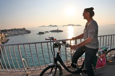 Glide through marseille by e-bike, from the lively old port to notre-dame de la garde. small group, local guide, helmet and bike included for an easy day out.