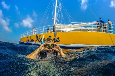 Feel the sea breeze on an aruba afternoon catamaran cruise, snorkel the antilla shipwreck, enjoy open bar snacks, and relax with hotel pickup included.