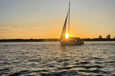 Watch the sun set over gold coast’s skyline on a 2-hour sailing cruise. sip sparkling wine, enjoy a tasting plate, and spot dolphins with a small group. includes drinks.