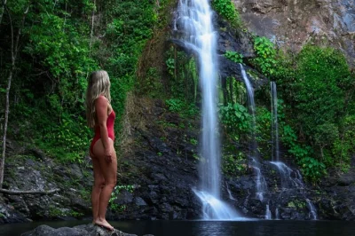 Swim at cassowary falls, ride atvs through daintree, spot crocs on a river cruise. includes pickup from port douglas and lunch in daintree village.