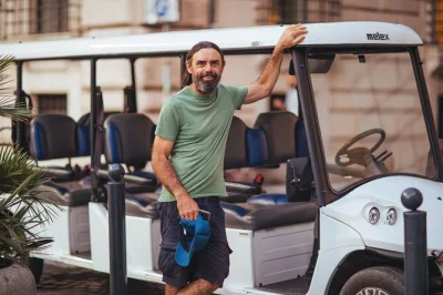 Feel rome come alive after dark on a golf cart tour with prosecco, local snacks, and a friendly guide. includes pickup, drinks, and city highlights.