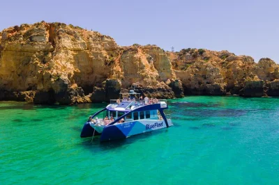 Soak up the algarve coast on a lagos & ponta da piedade boat cruise, with swimming stops, portuguese lunch, drinks, and a friendly local crew. includes pickup.