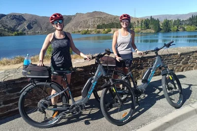 Pedal the lake dunstan cycleway from cromwell to clyde, with e-bike rental, local stops for wine or coffee, and a luxury shuttle back. includes safety gear.