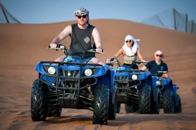 Feel the rush of dubai’s red sand dunes with quad biking, dune bashing, and a camel ride—includes hotel pickup, english-speaking guide, and bottled water.