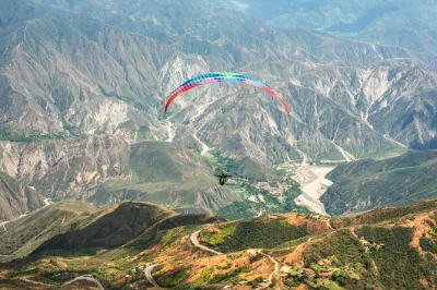Soar above chicamocha canyon with a pro pilot. tandem paragliding, all gear included. wheelchair accessible. book your flight for epic views now!