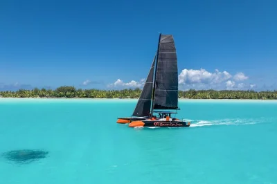 Start your day on a luxury catamaran in bora bora’s lagoon, snorkeling vibrant coral, sipping drinks at a floating bar, and relaxing with hotel pickup included.