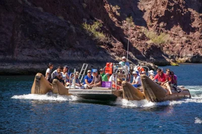 Float beneath hoover dam on a 1.5-hour raft tour in black canyon, spot wildlife, see historic relics, and enjoy snacks with a local guide—includes all gear.