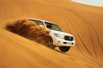 Feel the rush of dune bashing, taste arabic sweets, and relax at a desert camp with bbq dinner and live shows. includes dubai hotel pickup for an easy evening.