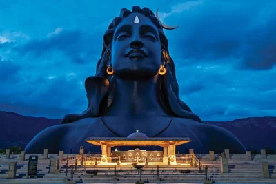Feel the energy of adiyogi in coimbatore with a 3d light show, sacred sounds, and stories under the velliangiri mountains. includes entry and bottled water.