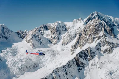 Feel the rush of a twin glacier helicopter flight over franz josef & fox glacier, land on ancient snow, and listen to live pilot commentary. includes guaranteed snow landing.