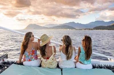 Feel the warm breeze on a 2-hour oahu sunset catamaran sail from ko olina, with cocktails, appetizers, and a local crew. includes drinks and light bites.