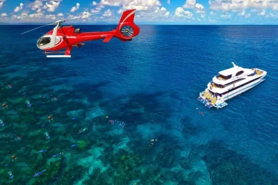 Feel the sea breeze on a full-day great barrier reef cruise from cairns, snorkel two reefs, enjoy a bbq lunch, and take a 10-minute scenic helicopter flight. includes gear & return wine.
