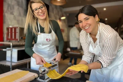 Step into a real roman kitchen near the vatican, learn to make fettuccine from scratch with an italian chef, and share a meal and wine at a lively communal table.