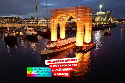 Amsterdam, crociera tra i canali per il festival delle luci con bevande calde illimitate, guida locale e viste suggestive sui canali illuminati. include snack tipici.