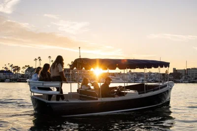Cruise newport harbor in a private electric boat, bring your own food and drinks, dock at waterfront restaurants, and explore with friends or family. includes all fees.