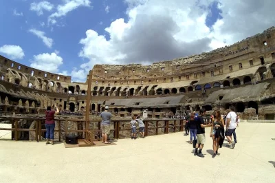 Step onto the colosseum arena floor in rome with an archaeologist, skip the lines, and explore the roman forum and palatine hill. includes entry tickets and headset.