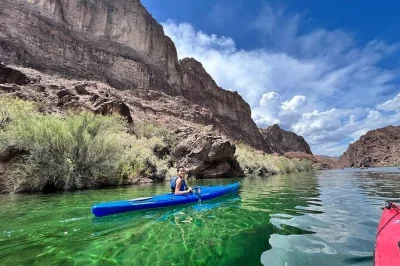 Float through black canyon’s emerald waters, paddle into the glowing cave, and meet local guides—includes snacks, bottled water, and optional hotel pickup.