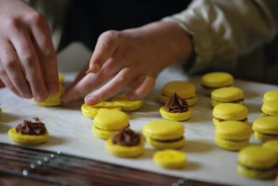 Step into a paris pastry studio for a hands-on macaron baking class with a local chef, small group size, and your own box of treats to take home. includes coffee or tea.
