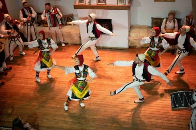 Step inside tirana’s vibrant albanian night show—folk music, wedding dances, and a seven-dish dinner. includes traditional attire, local stories, and central pickup.