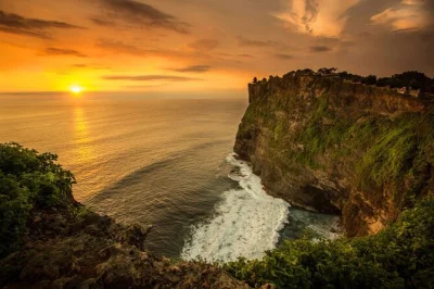 Feel the cliffside breeze at uluwatu temple, watch the kecak fire dance at sunset, and end with a balinese seafood dinner on jimbaran beach. includes pickup.