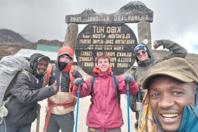 Feel the crunch of volcanic gravel, share stories with your tanzanian crew, and summit kilimanjaro via the scenic lemosho route. includes meals, tents, and pickup.