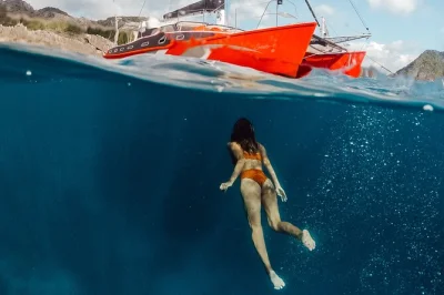 Feel the salt breeze, swim in secret lagoons, and share lunch on a private beach—el nido’s catamaran island hopping tour includes guide, towel, and pickup.